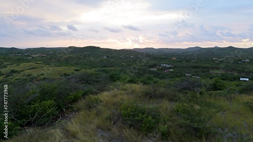 Panoramic aerial dolly above Curacao hiking hills in Caribbean outskirts on leeward side photo