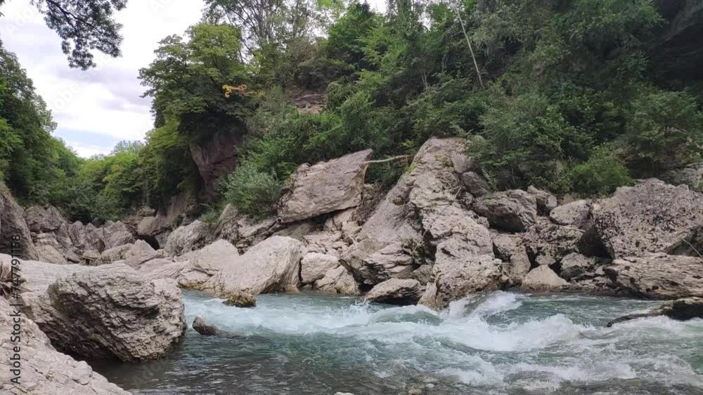 A stormy mountain river. Video landscape. Big stones A stormy mountain river. Video landscape. Big stones