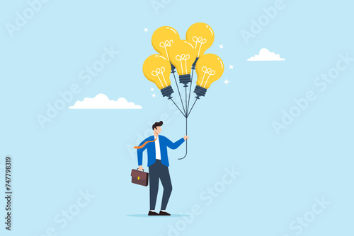 Businessman holds bright lightbulb idea balloons, illustrating innovation, creativity, and smart thinking. Concept of finding solutions, inspiration, imagination and wisdom to create new ideas