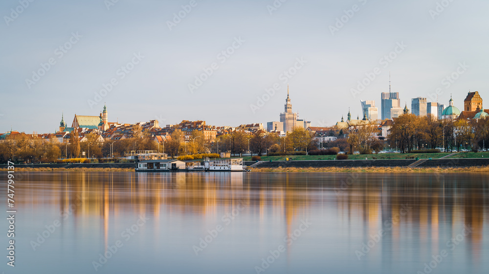 Warsaw, Poland - panorama of a city skyline at sunset. Cityscape view of Warsaw with Old Town and skyscrapers in downtown. Capital of Poland
