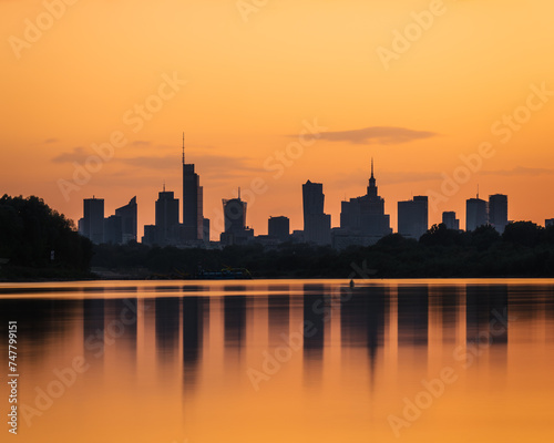 Warsaw, Poland - panorama of a city skyline at sunset. Cityscape view of Warsaw with reflection of skyscrapers