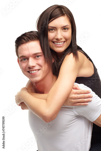 Portrait, couple and happy in studio with piggyback, love and romance in relationship. Partners, man and woman with smile or happiness, marriage and commitment or support on white background