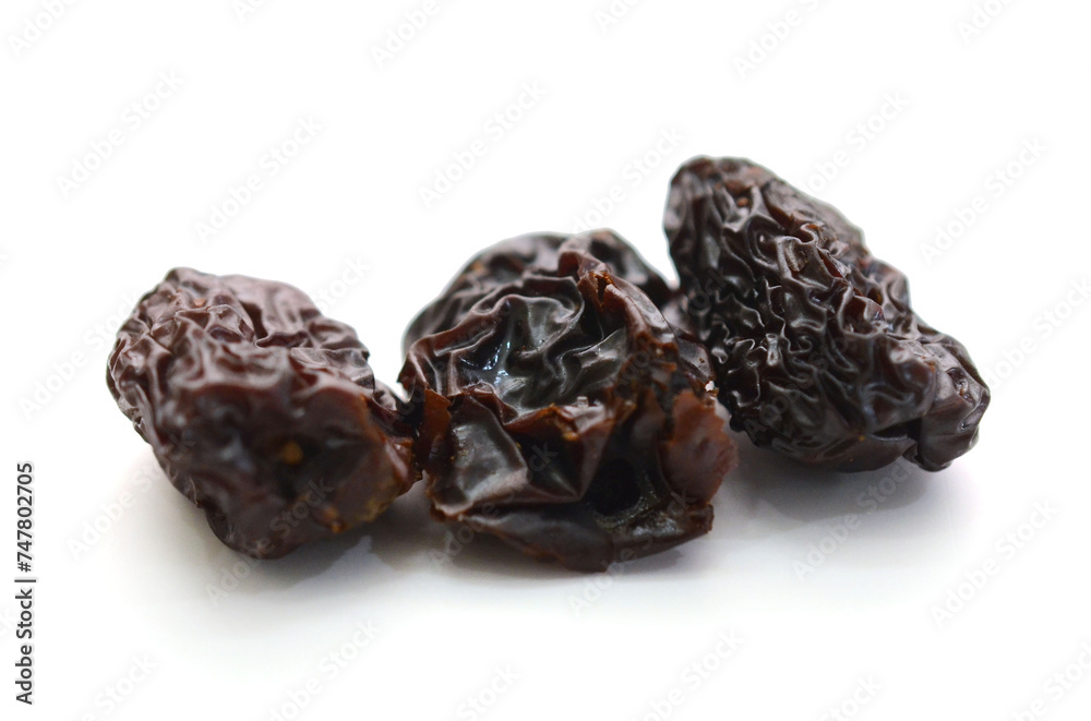 Raisins on a white background - stock photo
Raisins on a white background - stock photo