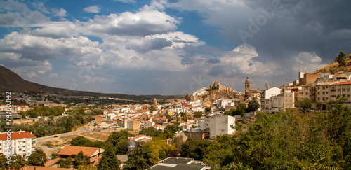 Vista panorámica de Loja desde el oeste, mirador de Sylvania. Vista de las casas y sus iglesias encajadas en el valle del río Genil. Pueblo rodeado de campos de cultivos y montañas. Loja, España. photo