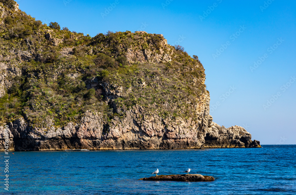 Panoramic view of Capo Mazzaro cape aside Isola Bella island at Taormina bay on Ionian sea shore in Messina region of Sicily in Italy