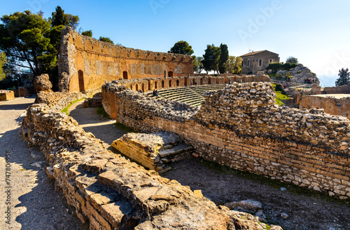 Greek and Roman period Teatro antico Ancient Theatre with cavea seating auditorium in Taormina at Ioanian sea shore of Sicily in Italy