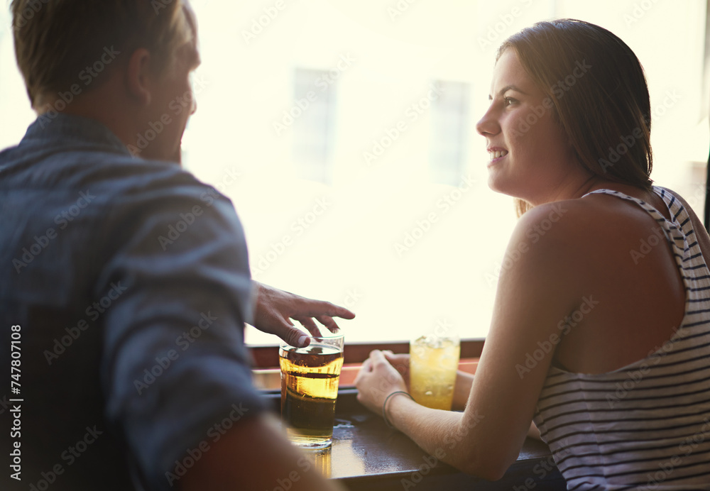 Talk, happy couple and drinking beer in pub, relax and leisure together in restaurant with alcohol. Smile, man and woman in conversation at bar for connection, relationship or bonding on date at club Talk, happy couple and drinking beer in pub, relax and leisure together in restaurant with alcohol. Smile, man and woman in conversation at bar for connection, relationship or bonding on date at club
