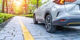 An Electric Car Gently Cruises on a Sunlit Path, Blending Innovation with Urban Greenery, Generative AI