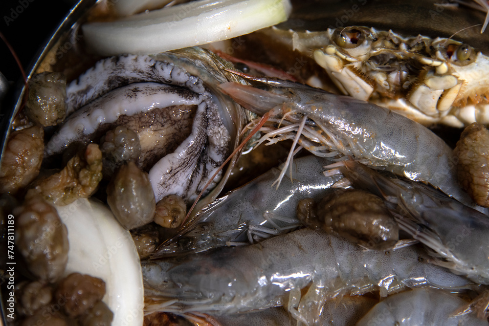 Food materials and ingredients for seafood stew in the pot Food materials and ingredients for seafood stew in the pot