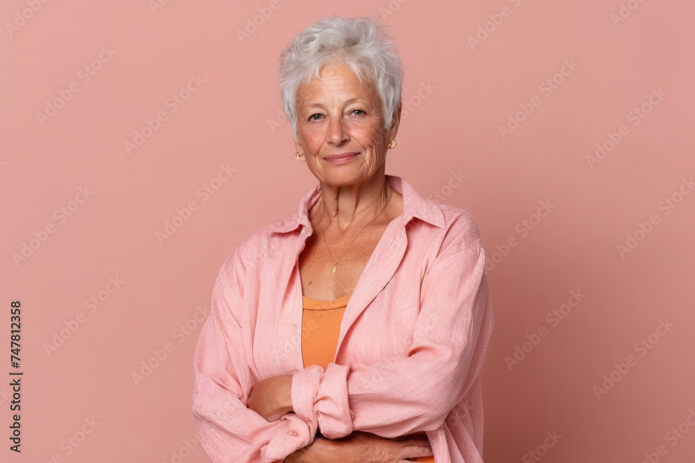 senior woman posing in front a seamless background senior woman posing in front a seamless background