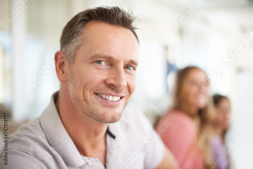 Smile, portrait and man on sofa to relax in family home for weekend leisure, bonding and free time. Calm father, mother and child on couch for holiday, wellness and face of happy dad in living room.