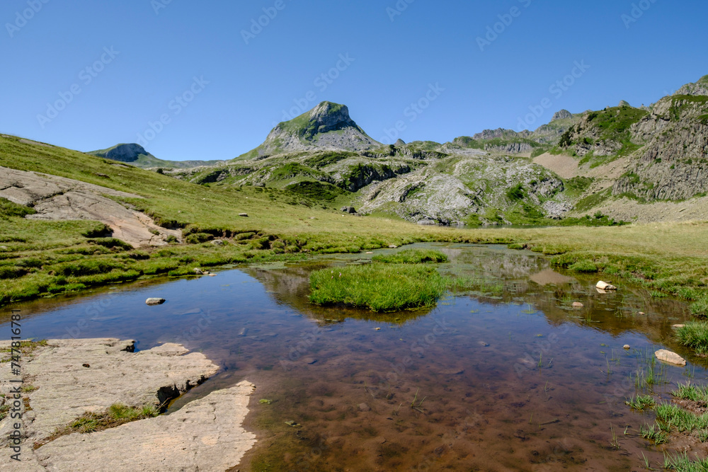 hikers on Lac du Miey, Ayous lakes tour, Pyrenees National Park, Pyrenees Atlantiques, France