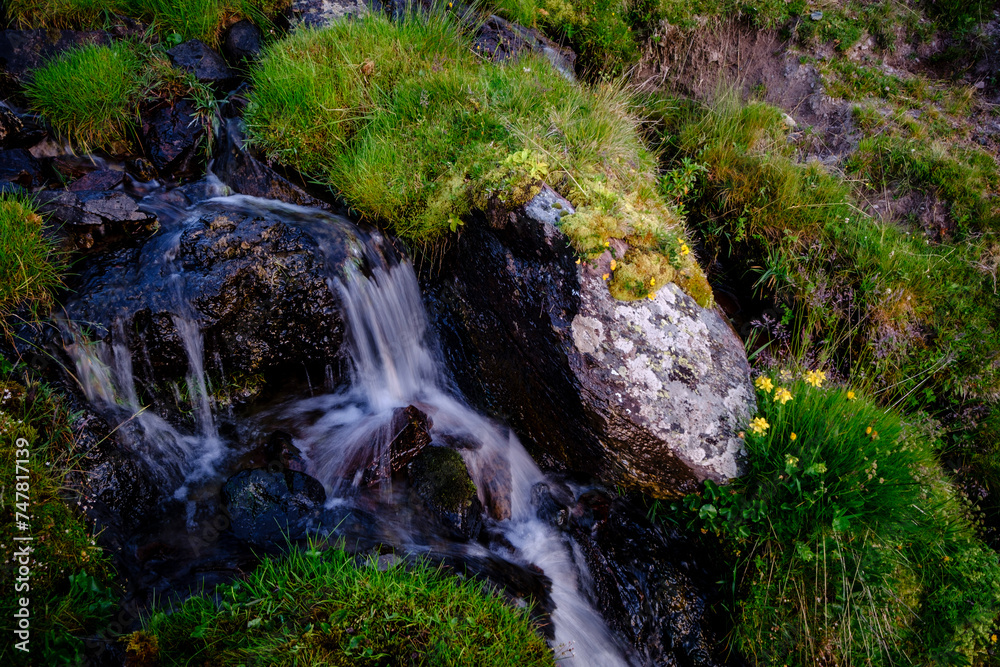 small waterfall front Midi d Ossau,  Gentau lake, Ayous lakes tour, Pyrenees National Park, Pyrenees Atlantiques, France