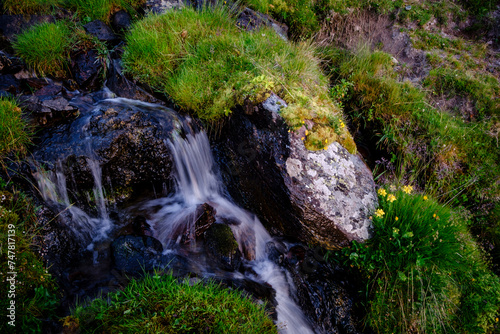 small waterfall front Midi d Ossau,  Gentau lake, Ayous lakes tour, Pyrenees National Park, Pyrenees Atlantiques, France photo