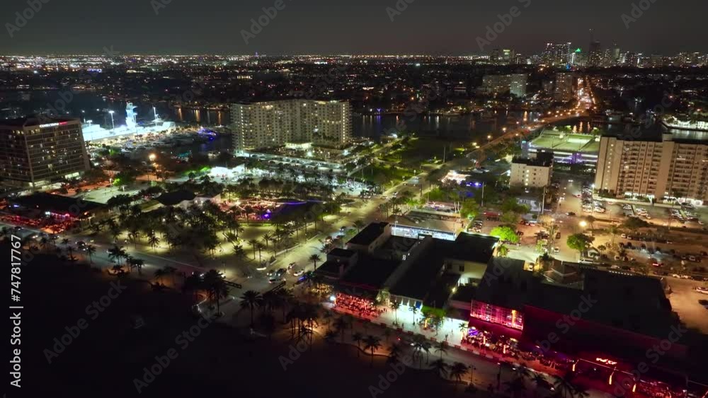 Fort Lauderdale city at night. Las Olas Beach in front of high luxury hotels and condos. High angle view of tourist infrastructure in southern Florida, USA. Fort Lauderdale city at night. Las Olas Beach in front of high luxury hotels and condos. High angle view of tourist infrastructure in southern Florida, USA.