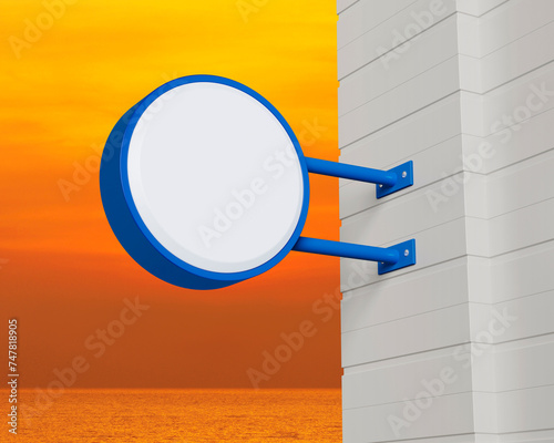 Hanging blue rounded signboard mockup over sunset sky and sea, Light box signage, 3D rendering