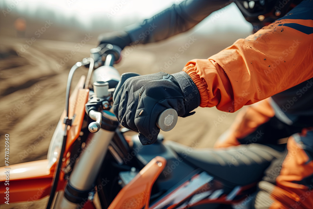 Dirt bike rider with hand on the throttle Dirt bike rider with hand on the throttle