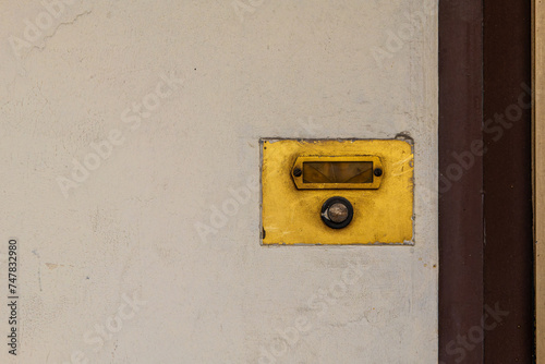 old brown single weathered doorbell