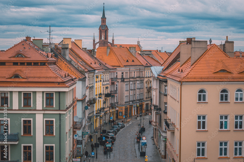 Urban landscape from a drone with a view of a church, city streets on a beautiful spring day with blue sky, a lot of architecture and infrastructure