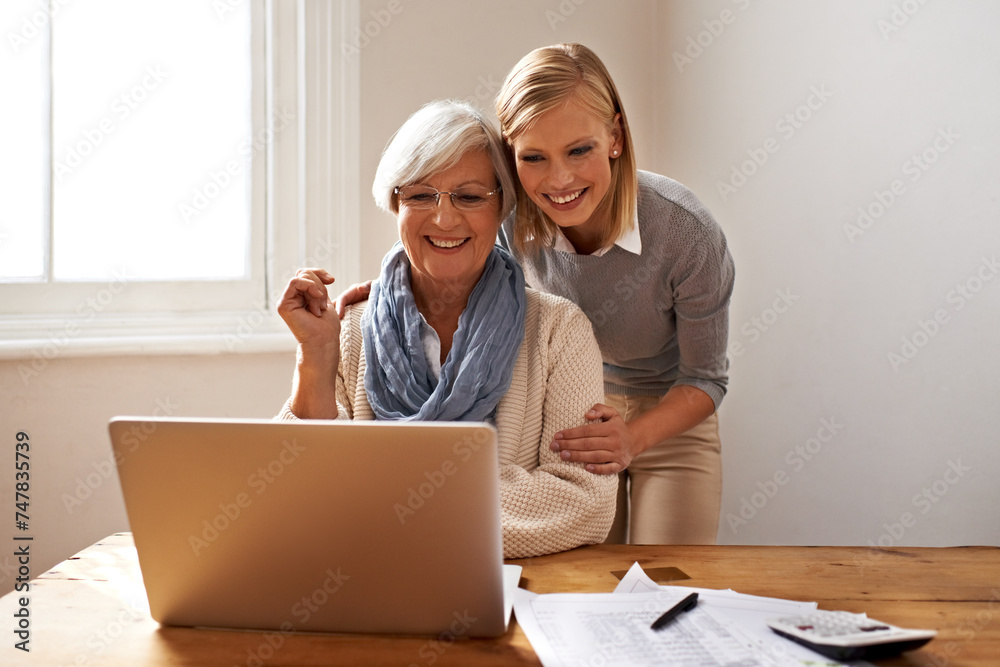 Woman, senior mother and laptop for finance in home, support and help for ecommerce on website. Daughter, old person and paperwork for tax return, investment and teaching on tech for online banking Woman, senior mother and laptop for finance in home, support and help for ecommerce on website. Daughter, old person and paperwork for tax return, investment and teaching on tech for online banking