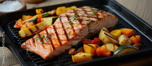 A close-up view of a plate filled with a deliciously grilled salmon steak accompanied by sizzled vegetables. The vibrant colors of the vegetables complement the rich texture of the salmon.