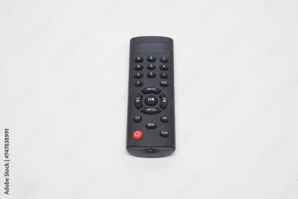a black remote music player flat lay on a white background a black remote music player flat lay on a white background