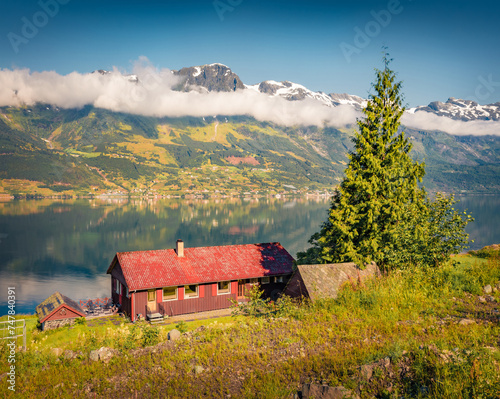 Adorable summer view of Lofthus village in Ullensvang municipality which is located in the Hardanger region of Hordaland county, Norway, Europe. Beauty of countryside concept background. photo