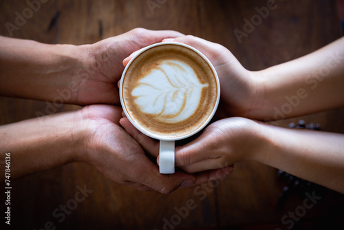 Hot coffee in the hands of a loved one. Coffee cup in woman's hand.