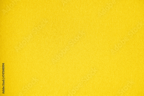 Vibrant Yellow Textured Cardstock Close-Up.