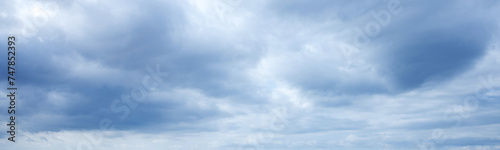 Web banner 4x1. Gloomy sky over the sea with cloud breaks