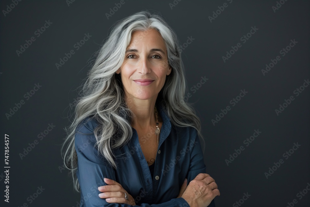 mature woman with gray hair and blue shirt