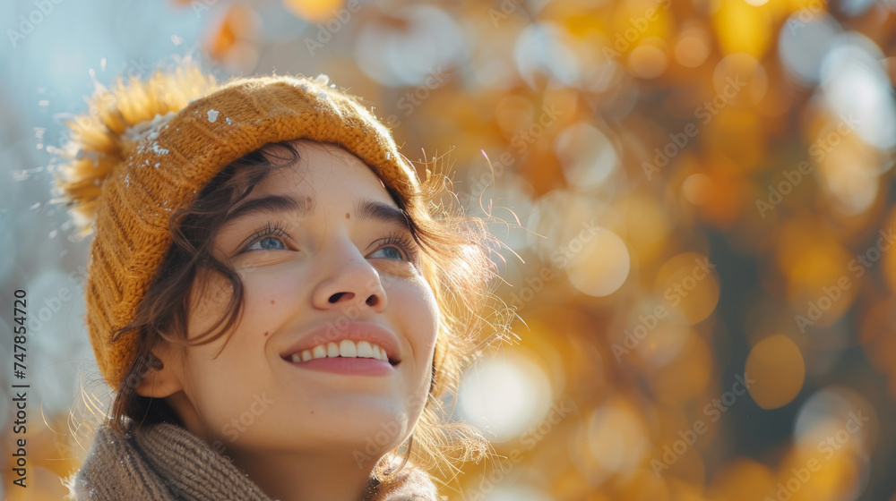 Youthful girl in warm attire looking upwards with autumn leaves around Youthful girl in warm attire looking upwards with autumn leaves around