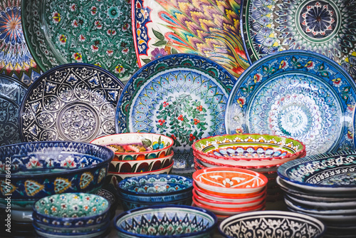 Multi-colored ceramic products with oriental ornaments at the Siab Bazaar in the ancient city of Samarkand in Uzbekistan, Siyob bozor