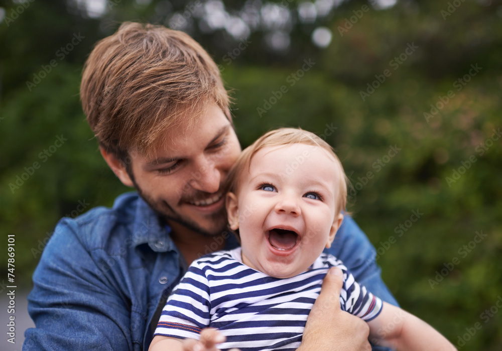 Father, laughing and baby in park to hug for playing, happiness and bonding in a family in nature. Relax, boy or face of a toddler with dad, love or smile for child development, wellness or growth Father, laughing and baby in park to hug for playing, happiness and bonding in a family in nature. Relax, boy or face of a toddler with dad, love or smile for child development, wellness or growth