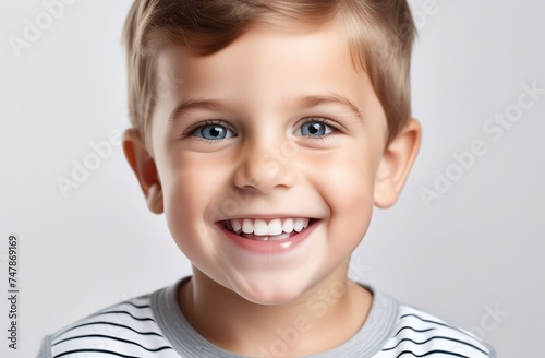 Cropped shot of the kid teeth on a white background. Baby with a tooth. Portrait of a little smiling boy tooth