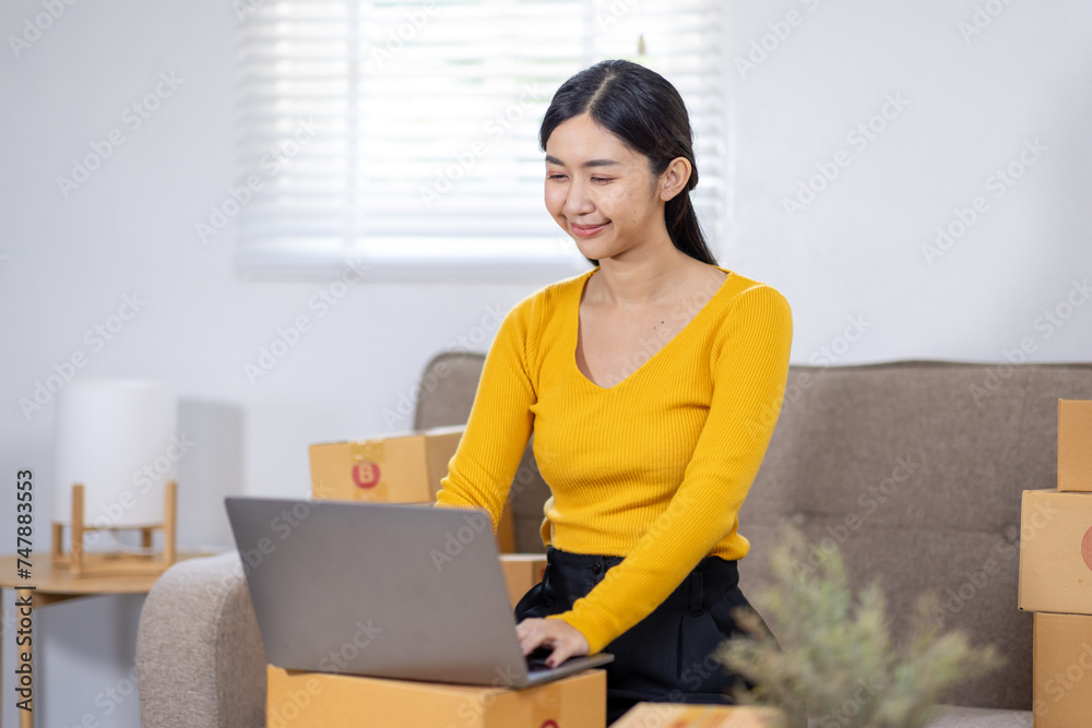 Startup small business entrepreneur SME freelance woman working with box, Young Asian small business owner office online market packing delivery, SME delivery e-commerce telemarketing seller concept Startup small business entrepreneur SME freelance woman working with box, Young Asian small business owner office online market packing delivery, SME delivery e-commerce telemarketing seller concept