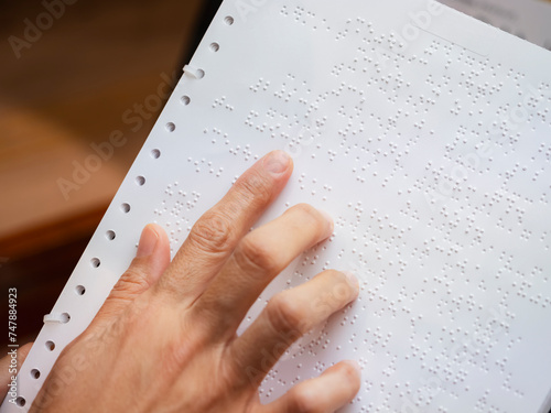 Papier peint Braille Alphabet with hand Reading book document for Blind People