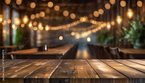 Photograph of a Wooden Table Against a Blurred Background of Restaurant Lights