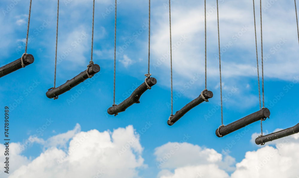 rope ladder against a blue sky and clouds rope ladder against a blue sky and clouds