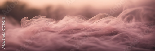 Close-up image highlighting the delicate wisps of smoke gently unfolding against a background of dusky rose.
