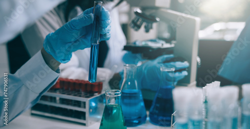 Science and medicine, scientist analyzing and dropping a sample into a glassware, experiments containing chemical liquid in laboratory on glassware, innovative and technology.