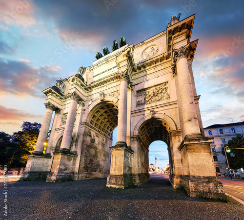 Dramatic sunset over Siegestor - Victory Gate  arch in downtown Munich, Germany