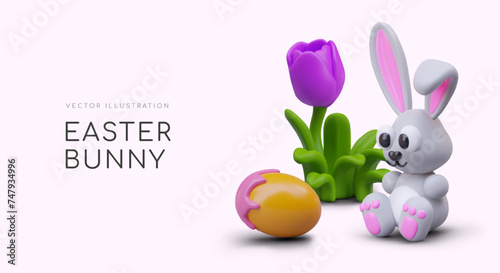 Cute realistic rabbit is sitting near tulips and looking at painted egg photo