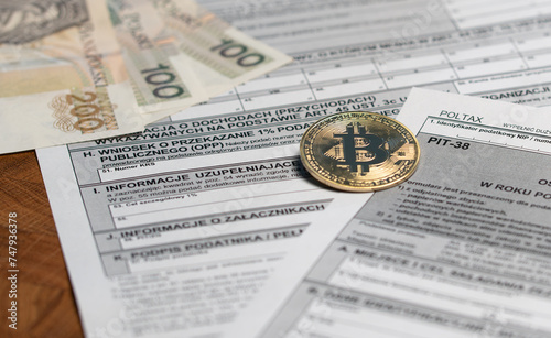 Crypto sale profit taxation - tax return pit-38 form for sale of shares and cryptocurrency investment. Polish tax settlement declaration with Bitcoin coin. photo