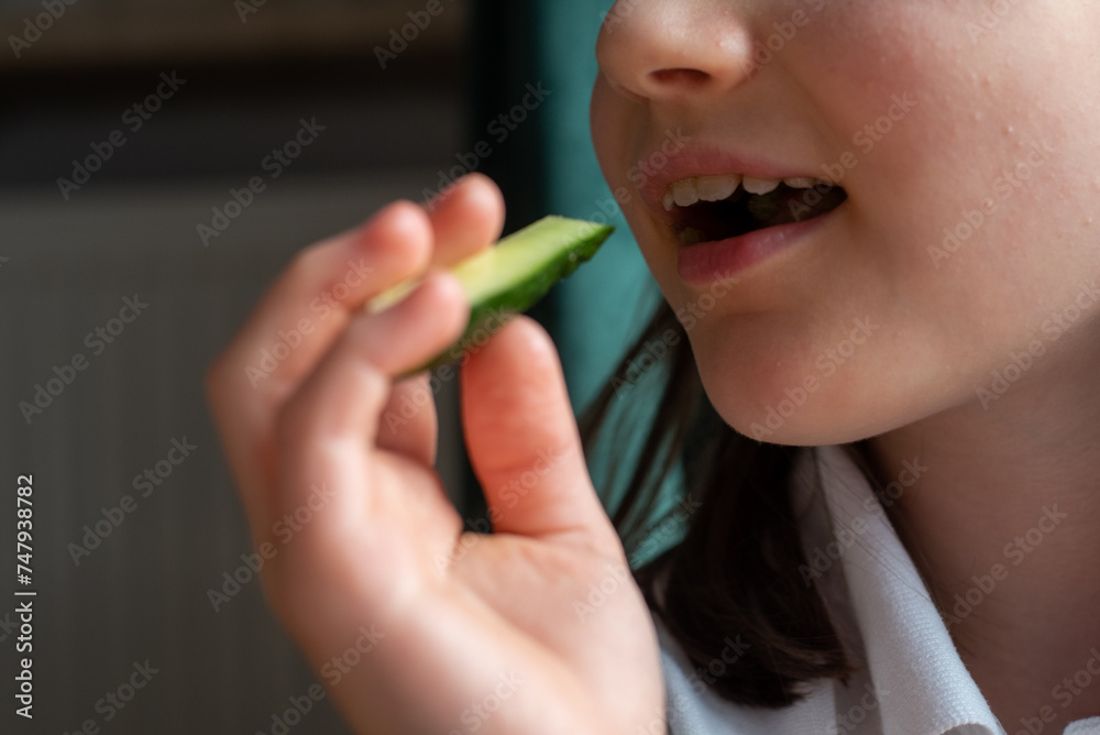 Child Eating Cucumber: Close-Up of Mouth Child Eating Cucumber: Close-Up of Mouth