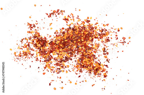 Red crushed hot chili pepper on a white background.