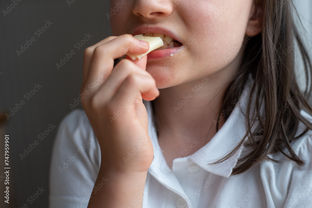 Child Eating Cheese: Close-Up Child Eating Cheese: Close-Up