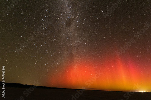 Bright red burst of Aurora Australis and milky way, Southern Australia