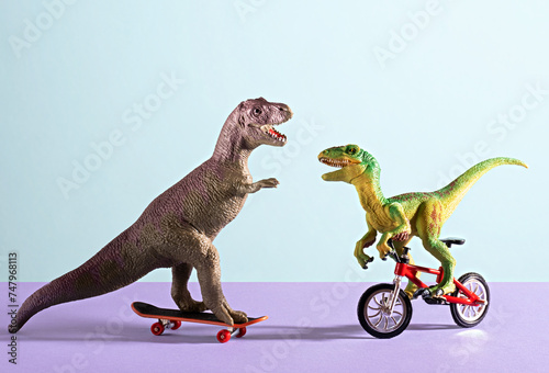 Two happy cute dinosaurs on bike and skate on blue and violet background.