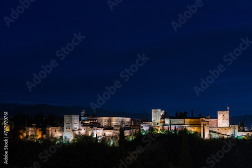 Panorama view of the Alhambra in Granada on a clear Spring night, a palace and fortress complex that remains one of the most famous monuments of Islamic architecture. © Andrés García